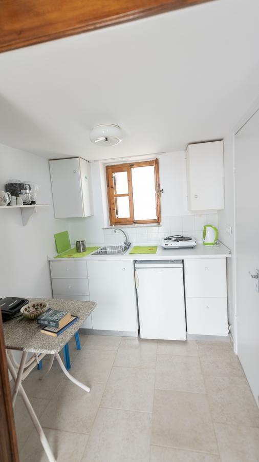 Roulas Apartments Chalki Town Exterior photo