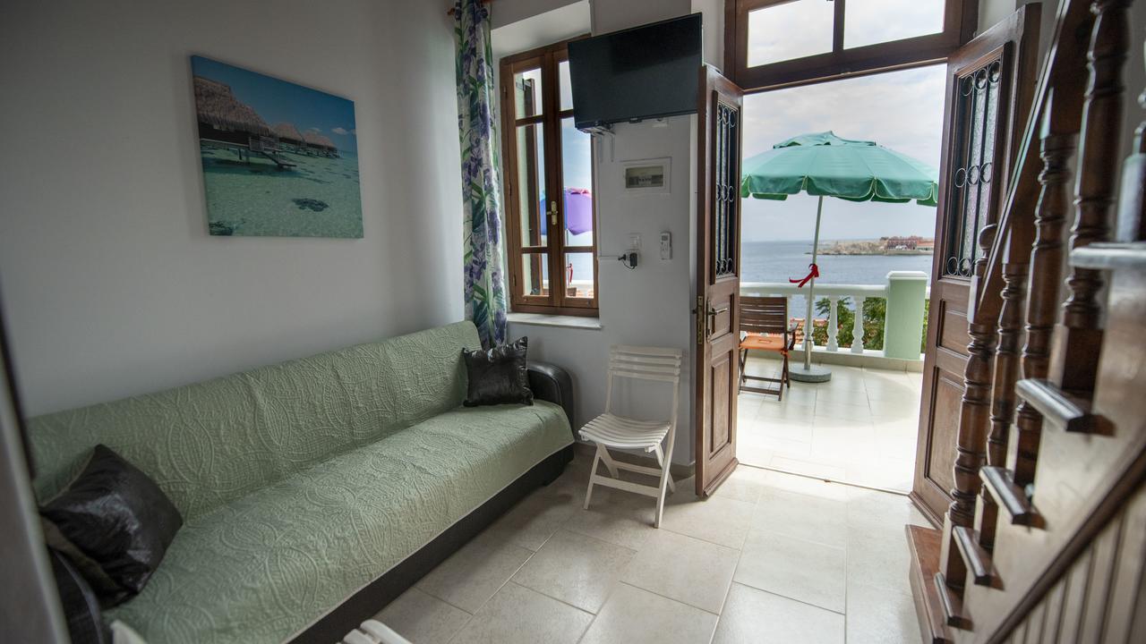 Roulas Apartments Chalki Town Exterior photo
